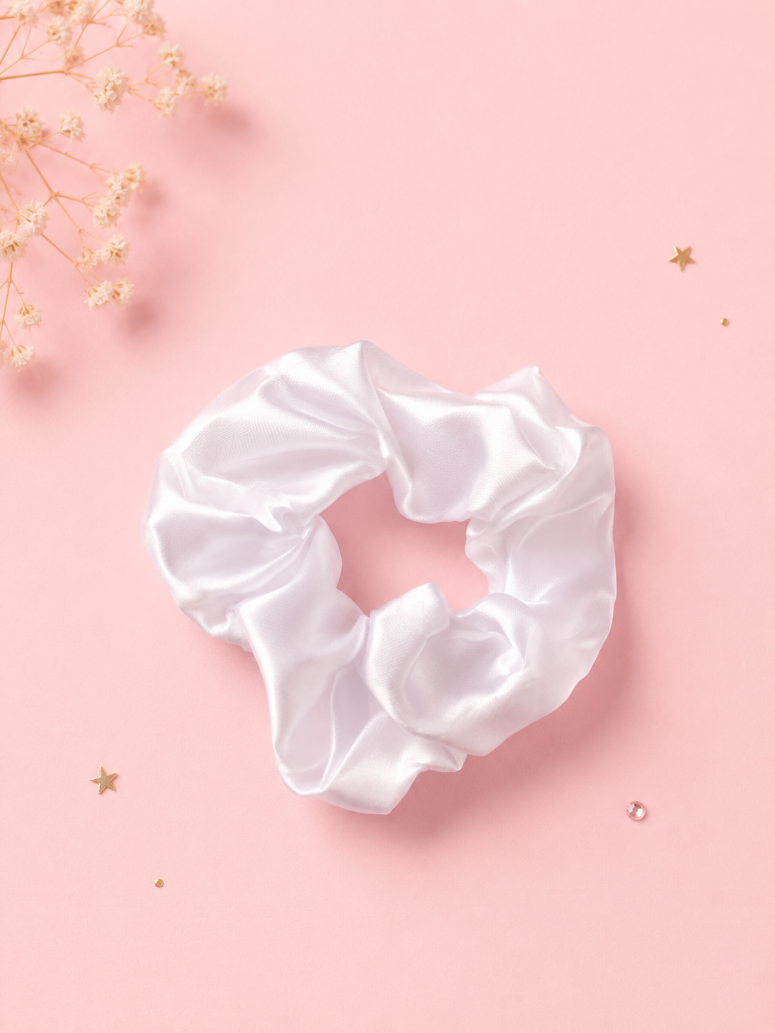 White silk scrunchie included in the Just Because gift box
